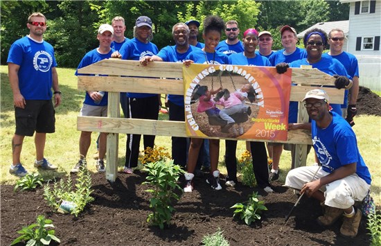 Volunteers beautifying a lot in East Akron