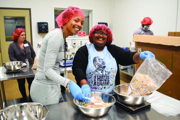 Akron-Canton Regional Foodbank volunteers help to package food